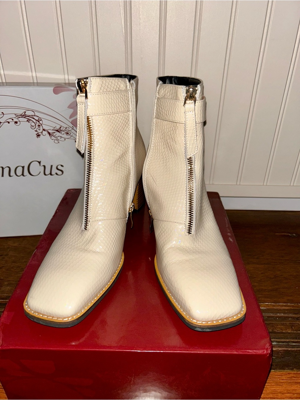 Cream Front-Zip Ankle Booties with Tassel Detail
